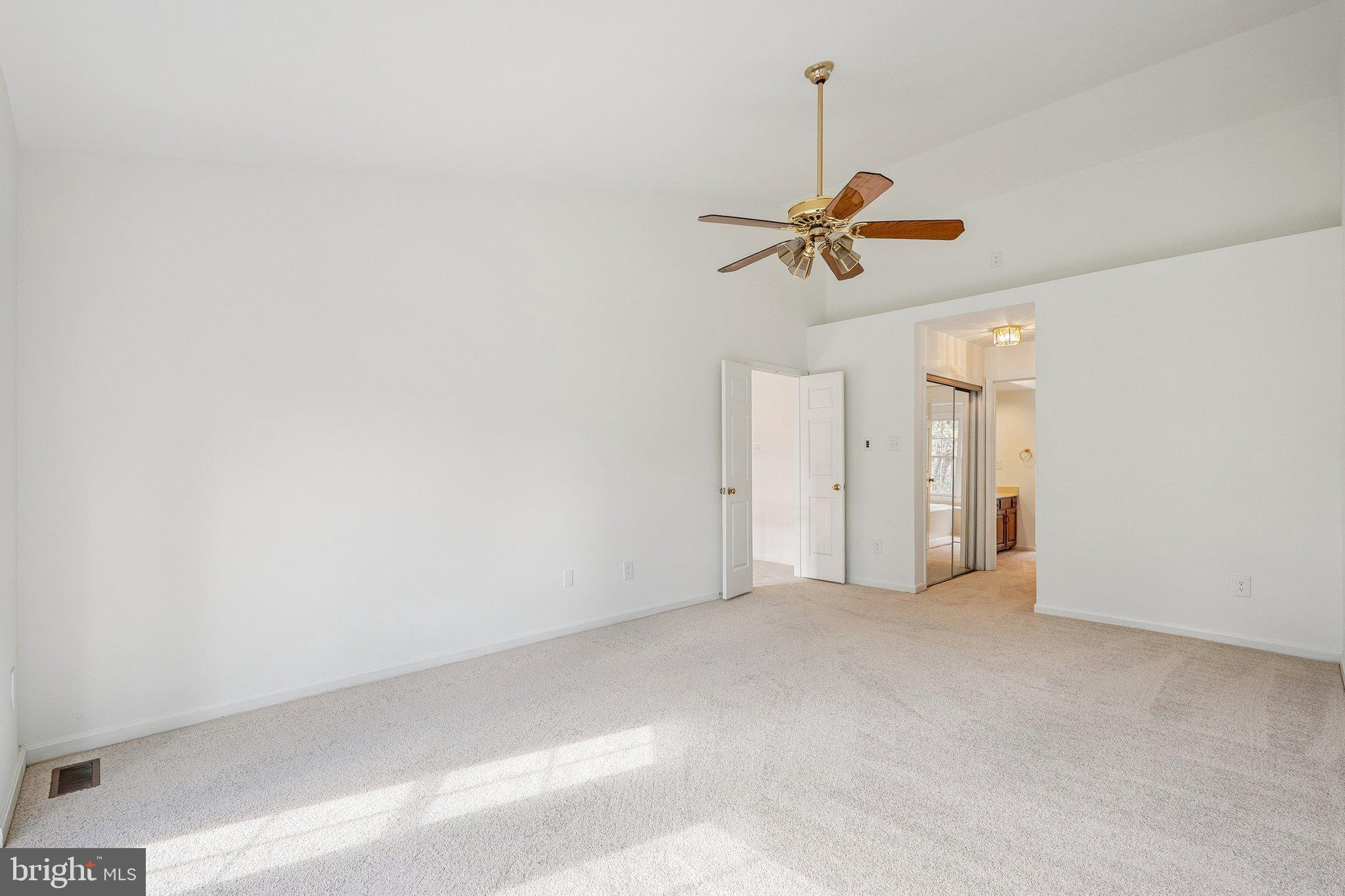 15056 Brown Post Lane Centreville, VA 20121 - Photo 24 of 45 an empty room with a window and a chandelier fan