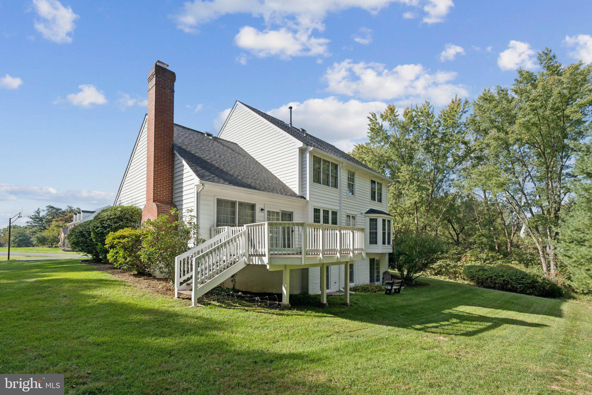 15056 Brown Post Lane Centreville, VA 20121 - Photo 41 of 45 a front view of a house with a garden