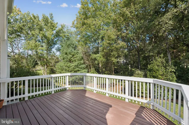 a view of balcony with wooden floor