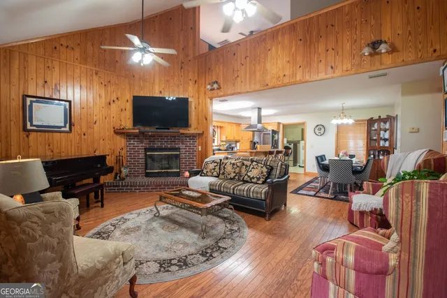a living room with furniture fireplace and a flat screen tv
