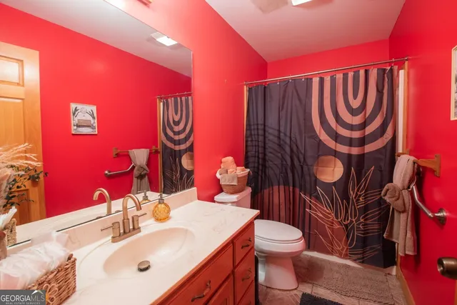a view of a livingroom with furniture and a flat screen tv