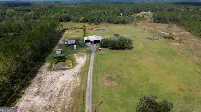 an aerial view of lake residential house with outdoor space and river