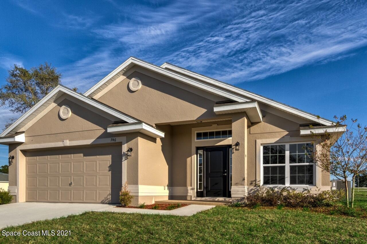 front view of a house with a small yard