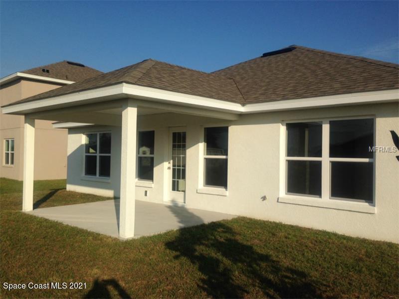 784 Moment Circle Cocoa, FL 32926 - Photo 12 of 14 a front view of a house with a yard