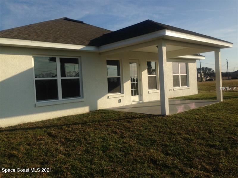 784 Moment Circle Cocoa, FL 32926 - Photo 13 of 14 a front view of a house with a yard