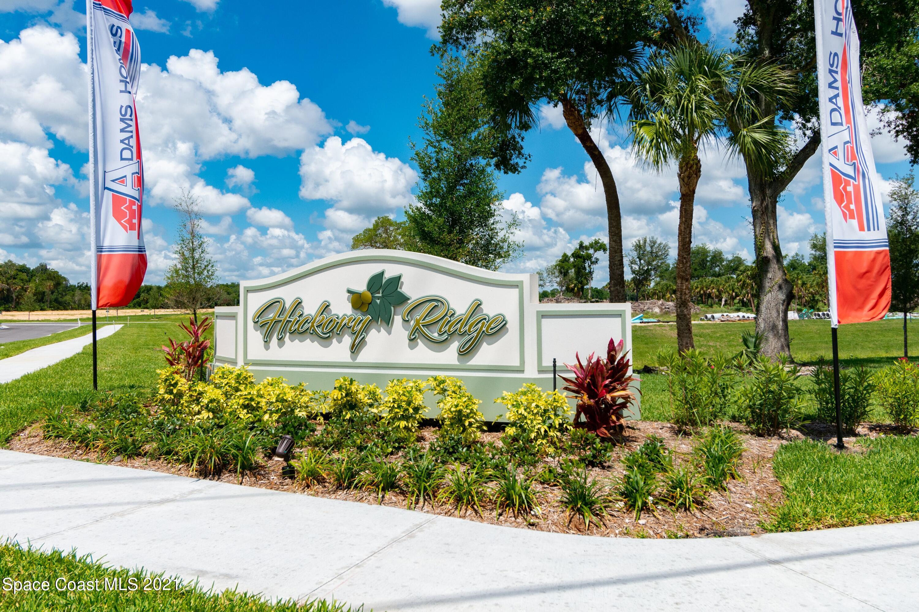 784 Moment Circle Cocoa, FL 32926 - Photo 14 of 14 a view of sign board with flower around