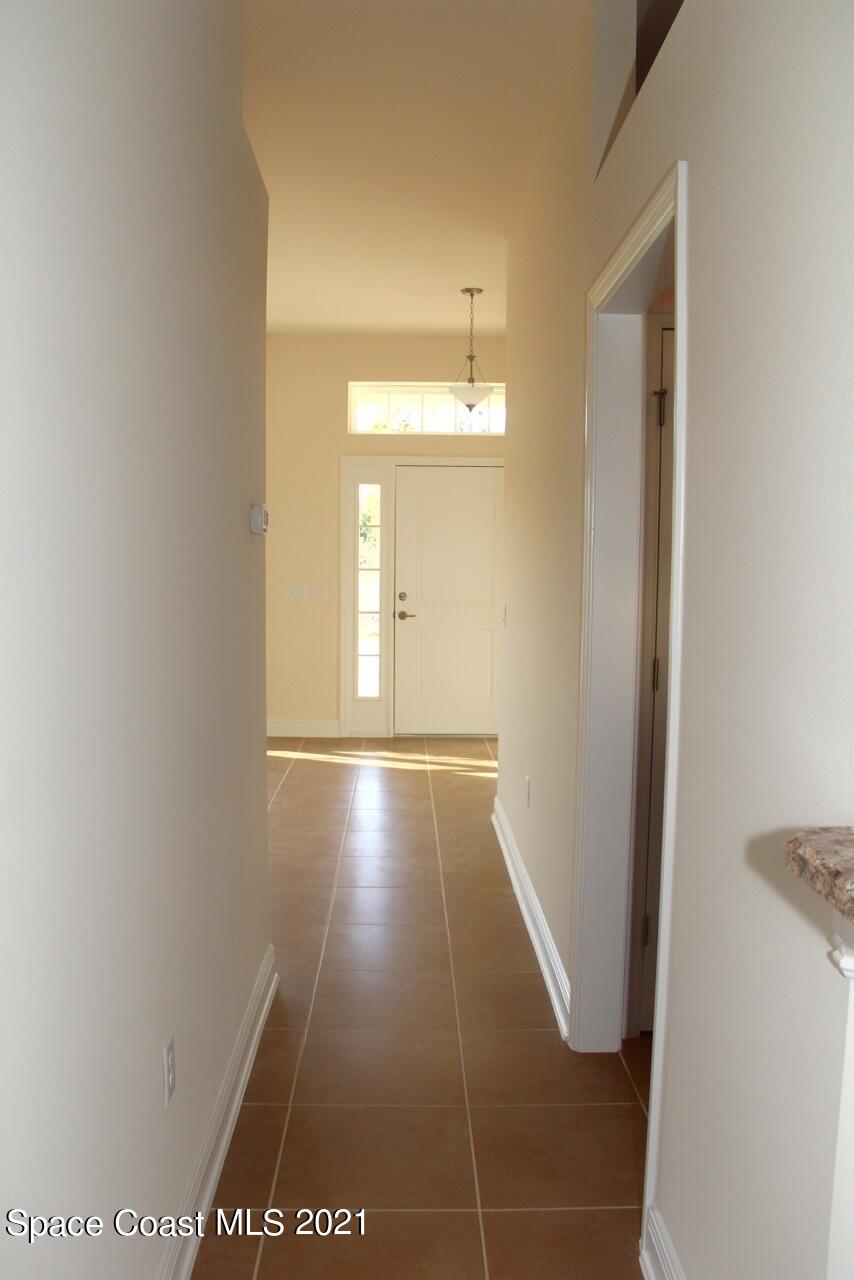 784 Moment Circle Cocoa, FL 32926 - Photo 5 of 14 a view of hallway with wooden floor
