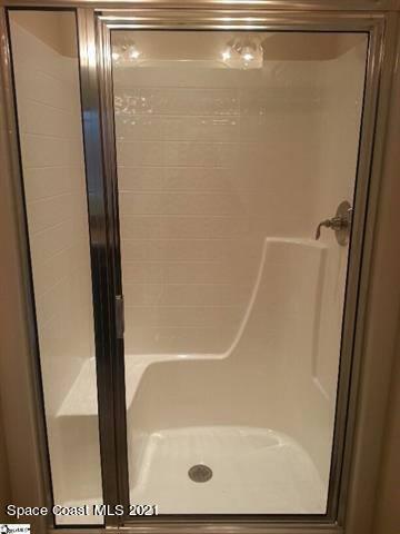 784 Moment Circle Cocoa, FL 32926 - Photo 8 of 14 a bathroom with a glass shower door
