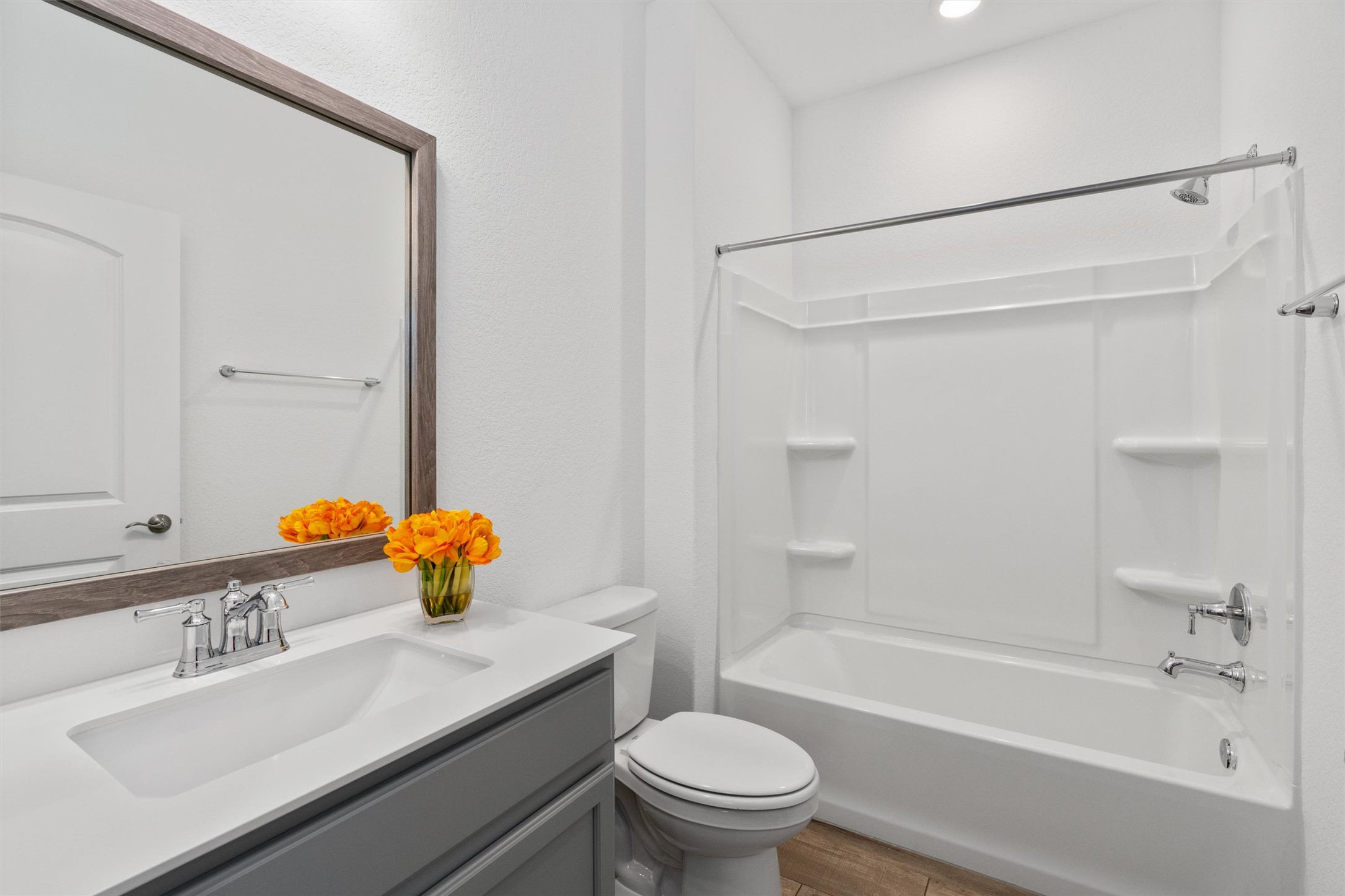 202 Spanish Star Street Georgetown, TX 78633 - Photo 25 of 32 a bathroom with a sink mirror toilet and bathtub