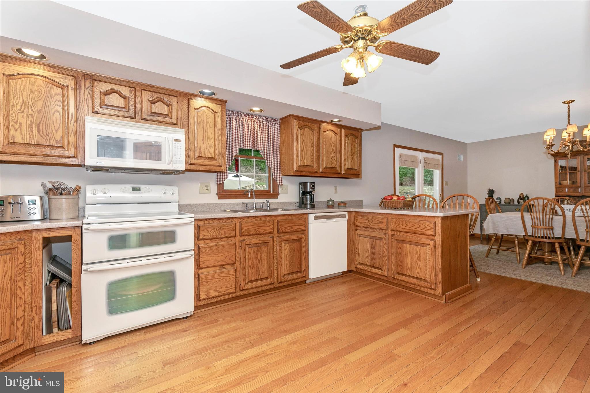 20804 Townsend Road Rohrersville, MD 21779 - Photo 24 of 49 Nice size kitchen with hardwood floor &ceiling fan