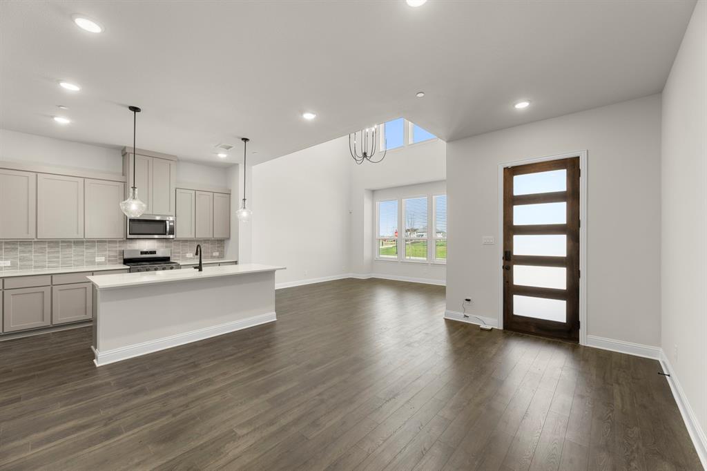 3916 Keya Drive Prosper, TX 75078 - Photo 5 of 28 a view of kitchen with sink and wooden floor
