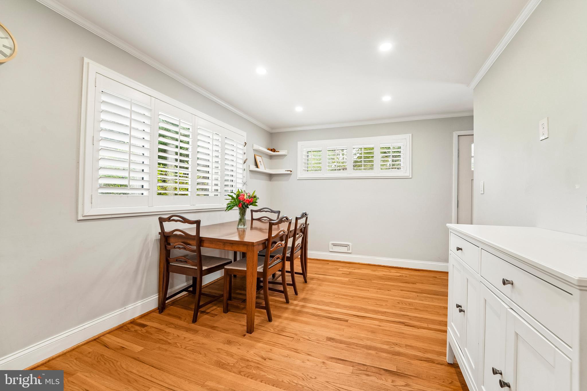 6640 Loch Hill Road Baltimore, MD 21239 - Photo 11 of 35 a view of a dining room with furniture and wooden floor