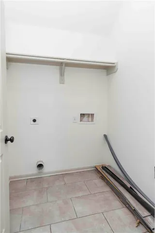 a view of a backyard with wooden fence