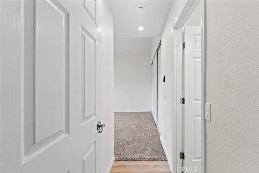 711 West 1st Street Santa Ana, CA 92701 - Photo 17 of 23 a view of a hallway with wooden floor and staircase