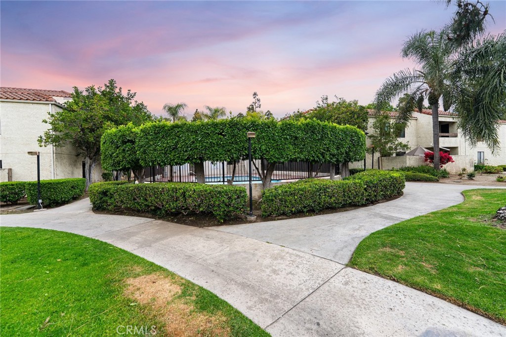 711 West 1st Street Santa Ana, CA 92701 - Photo 19 of 23 a view of a garden with a building in the background