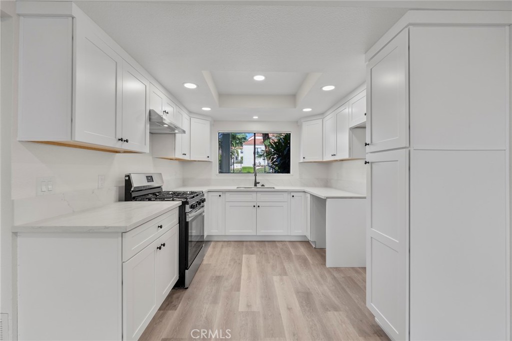 711 West 1st Street Santa Ana, CA 92701 - Photo 2 of 23 a large kitchen with a lot of counter space and stainless steel appliances