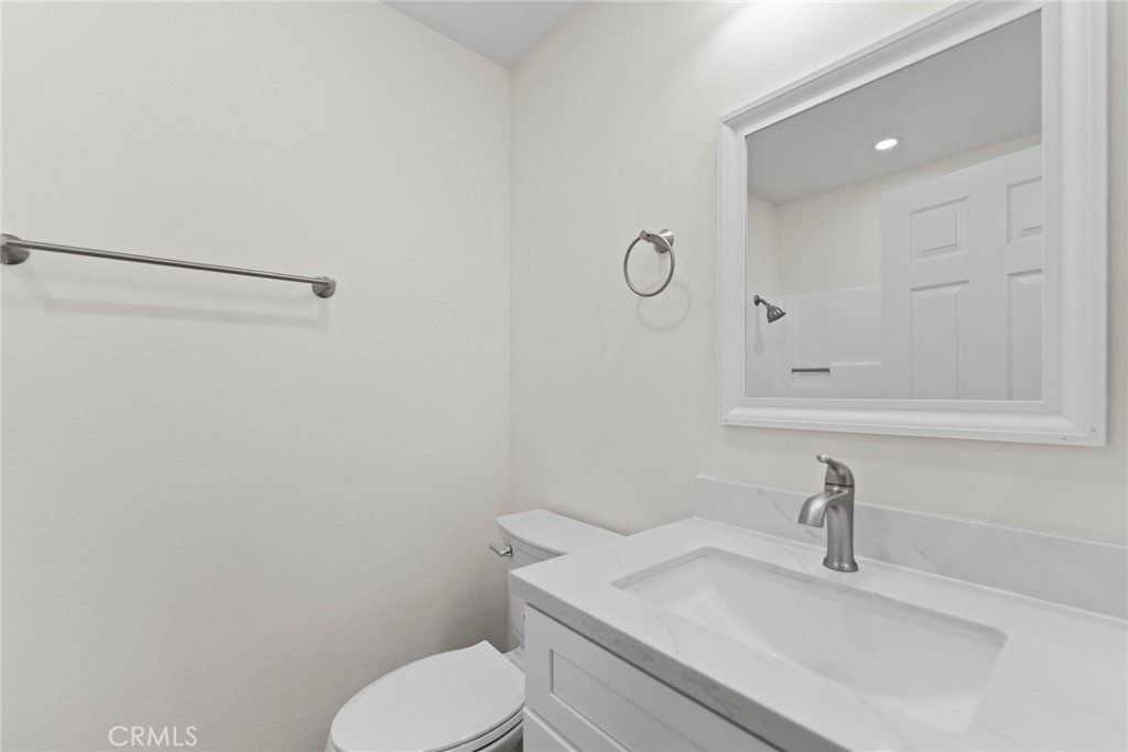 711 West 1st Street Santa Ana, CA 92701 - Photo 10 of 23 a bathroom with a sink toilet and vanity
