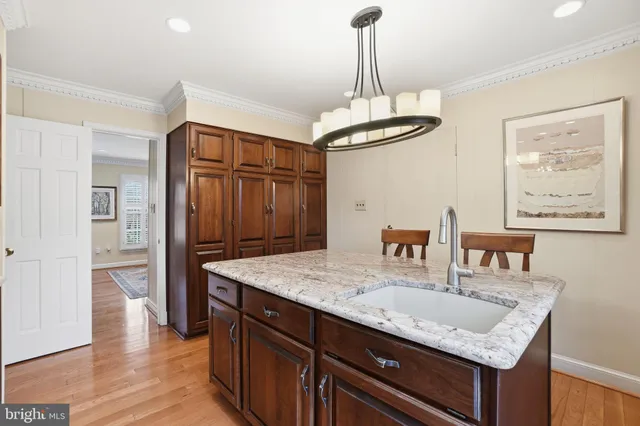 a kitchen with stainless steel appliances granite countertop stove top oven and refrigerator
