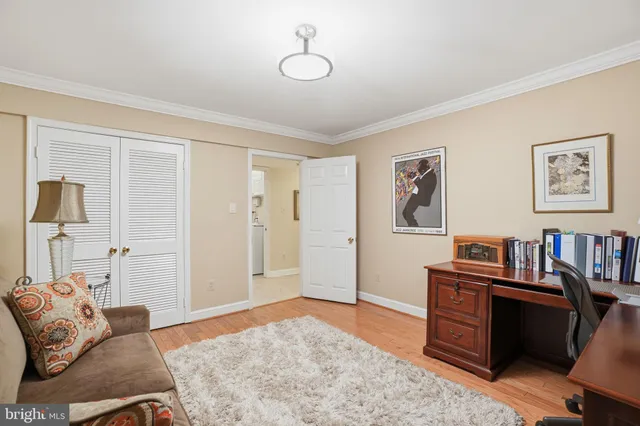 a bedroom with furniture and window