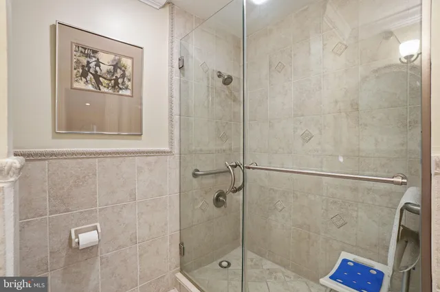 a bathroom with a shower and a shower