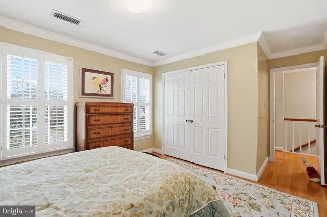 a bedroom with a bed and dresser