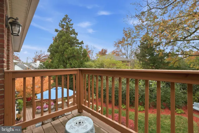 a view of a balcony with wooden floor