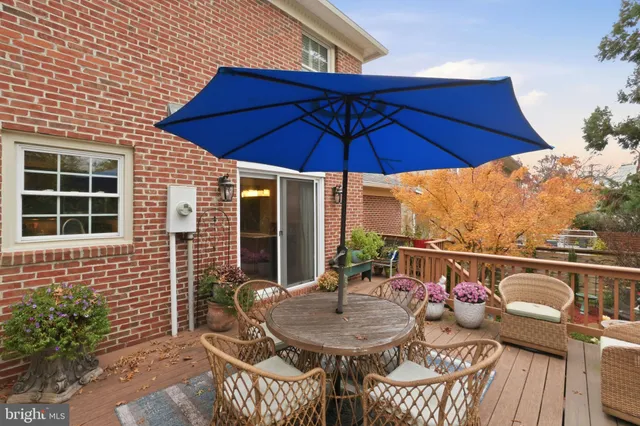 a balcony with table and chairs