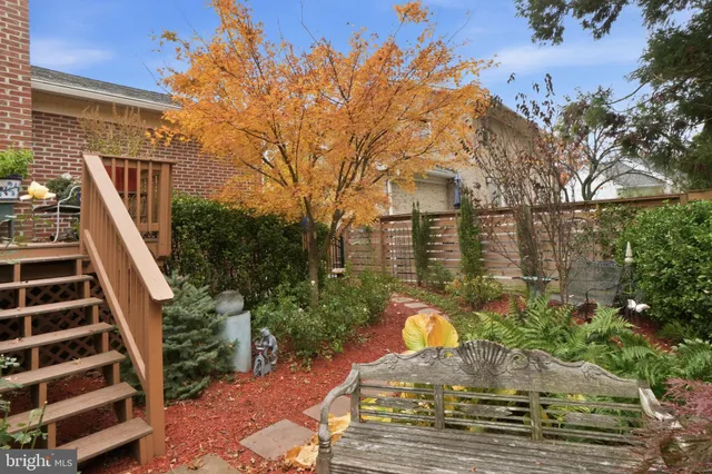 a view of a swimming pool with sitting area