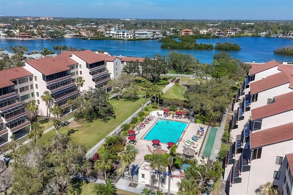 6285 Midnight Pass Road, Unit 403 Sarasota, FL 34242 - Photo 27 of 51 an aerial view of house with yard swimming pool and ocean view