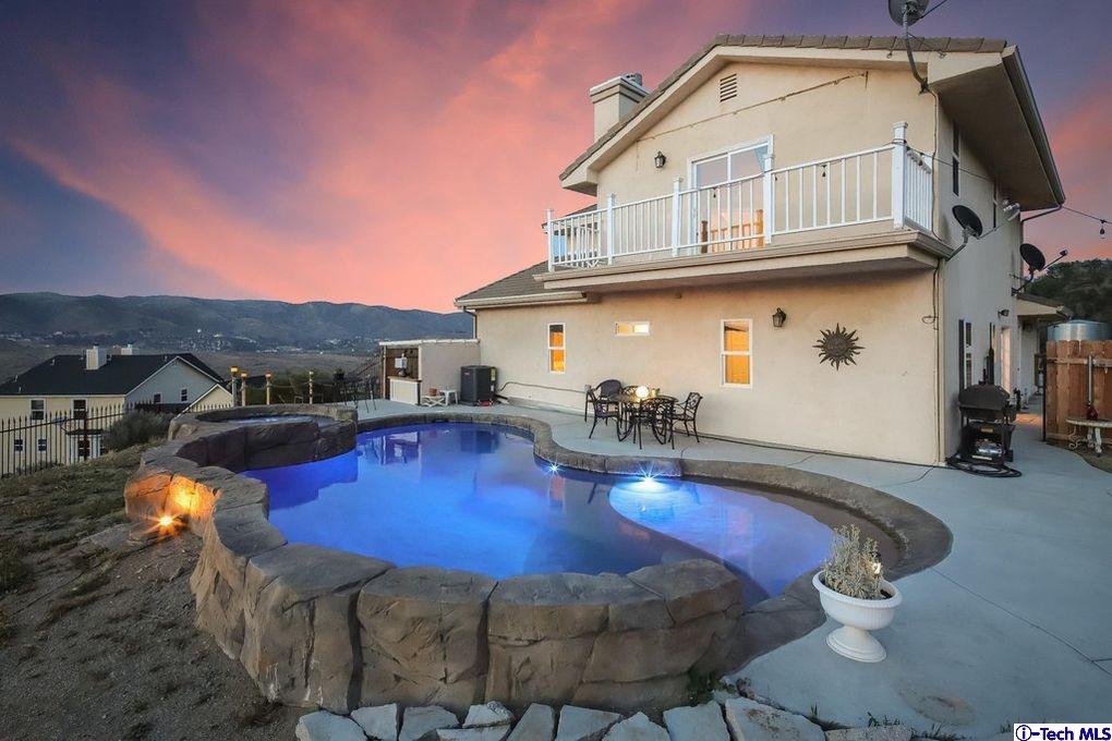 40251 Flintrock Road Leona Valley, CA 93551 - Photo 2 of 32 a view of a swimming pool with outdoor seating