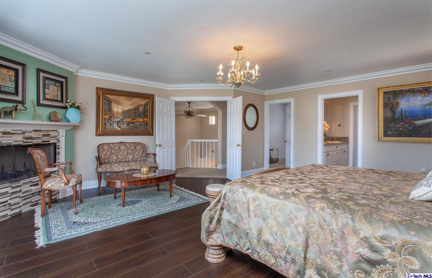 40251 Flintrock Road Leona Valley, CA 93551 - Photo 17 of 32 a spacious bedroom with a bed and wooden floor