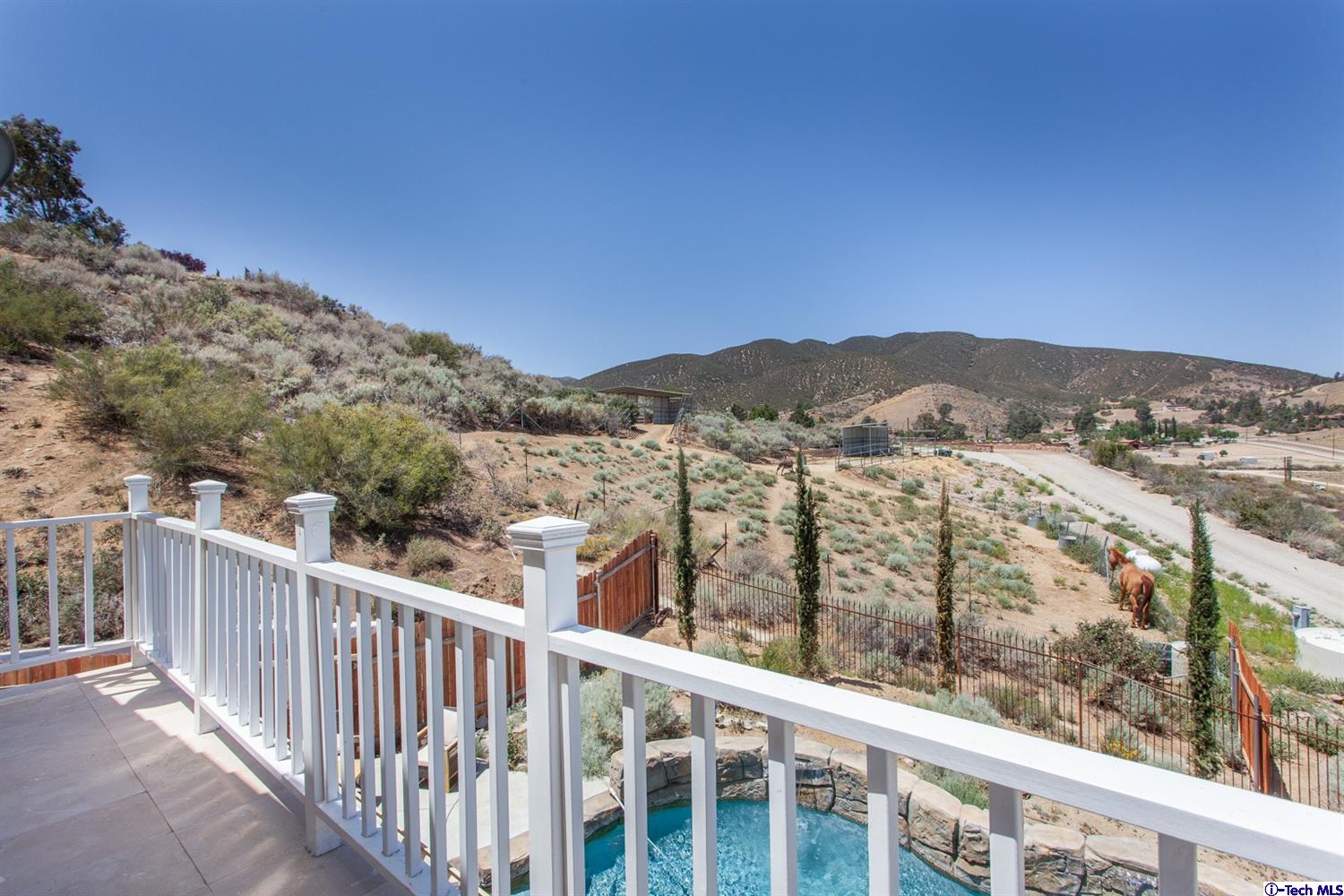 40251 Flintrock Road Leona Valley, CA 93551 - Photo 23 of 32 a view of a city from a balcony