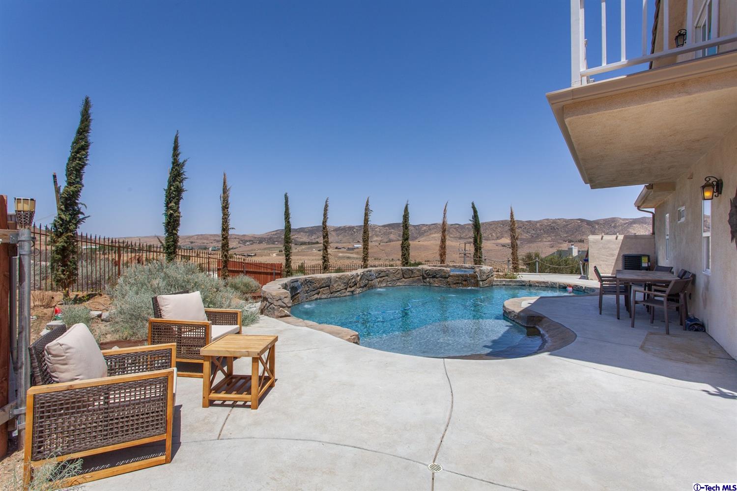 40251 Flintrock Road Leona Valley, CA 93551 - Photo 25 of 32 a terrace with outdoor seating and city view