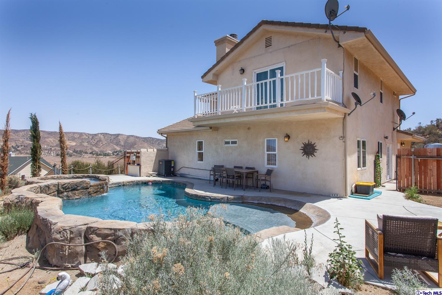 40251 Flintrock Road Leona Valley, CA 93551 - Photo 26 of 32 a view of a house with swimming pool and sitting area