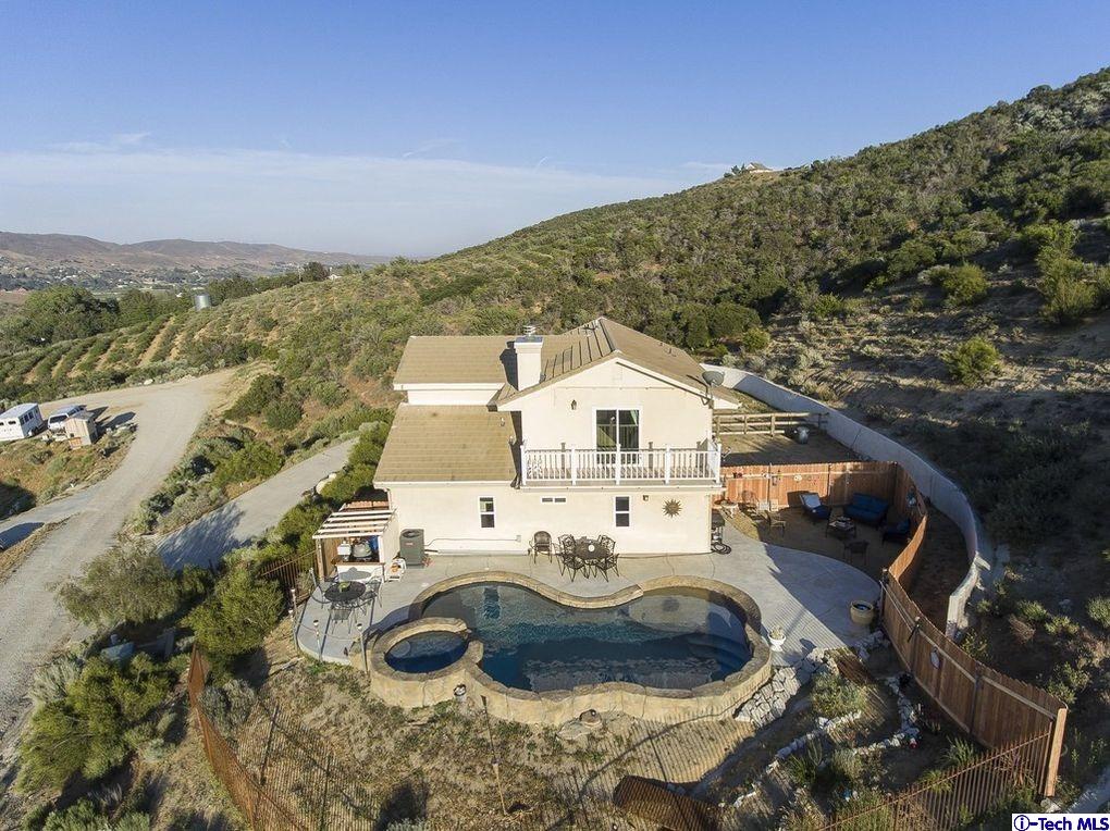 40251 Flintrock Road Leona Valley, CA 93551 - Photo 28 of 32 a view of a house with a yard