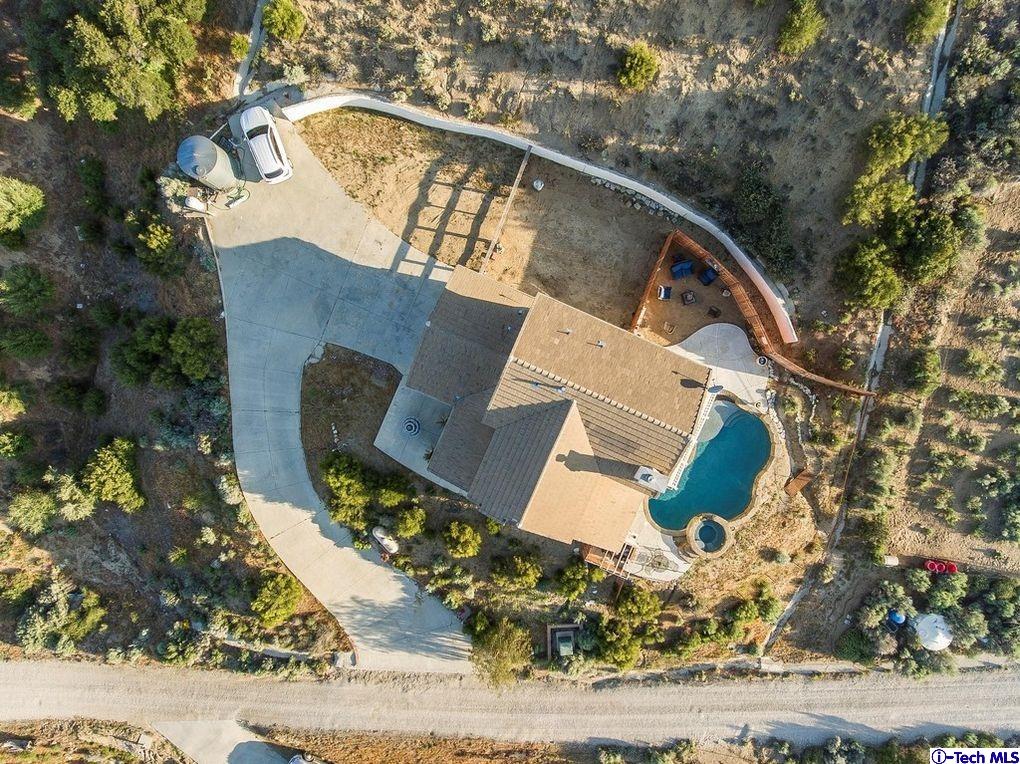40251 Flintrock Road Leona Valley, CA 93551 - Photo 31 of 32 an aerial view of a house with a yard and lake view