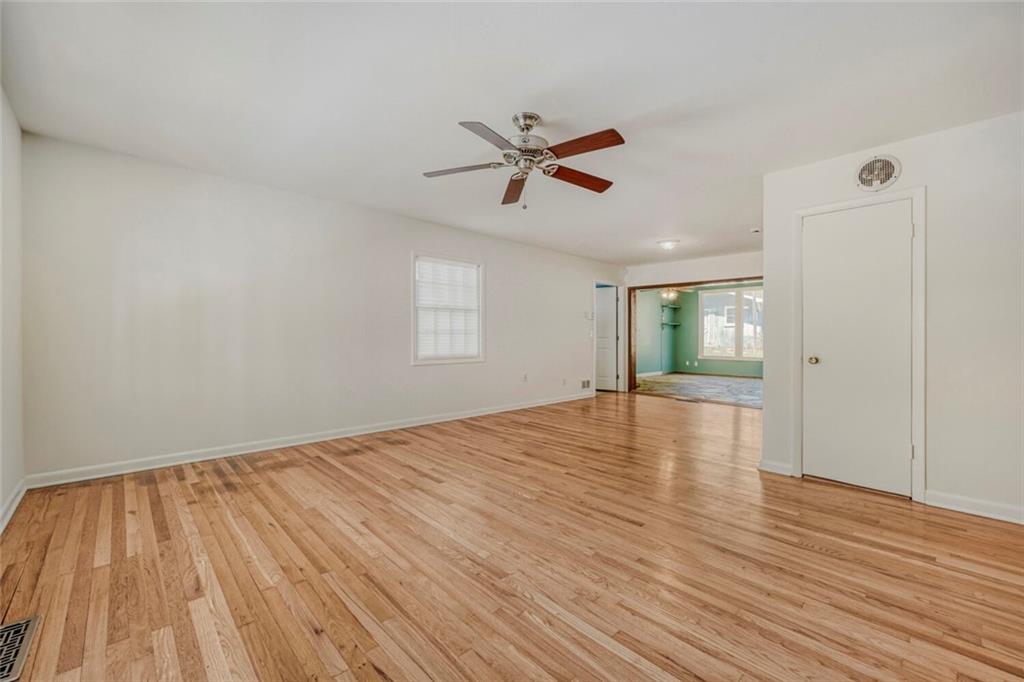 2754 Esquire Way Tucker, GA 30084 - Photo 13 of 49 a view of empty room with wooden floor and fan