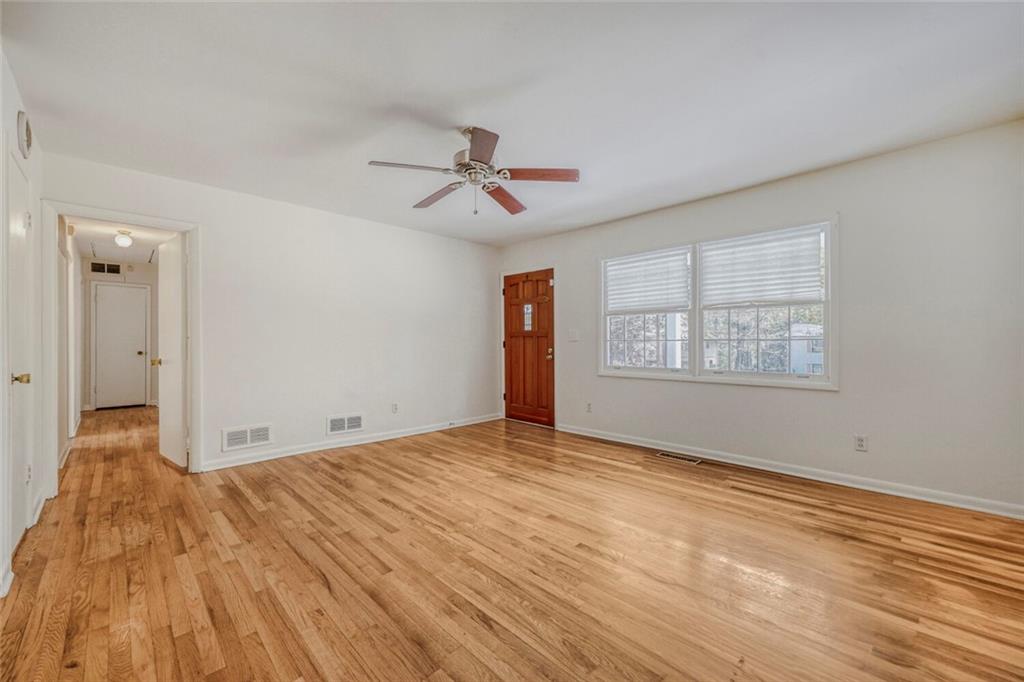 2754 Esquire Way Tucker, GA 30084 - Photo 15 of 49 a view of empty room with wooden floor and fan