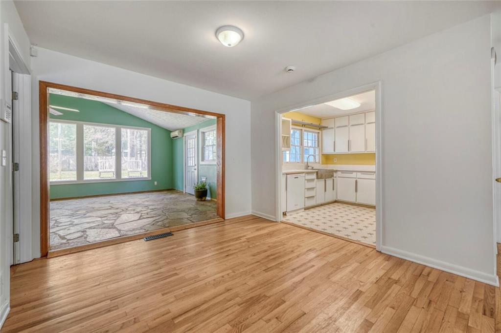 2754 Esquire Way Tucker, GA 30084 - Photo 16 of 49 an empty room with wooden floor and windows