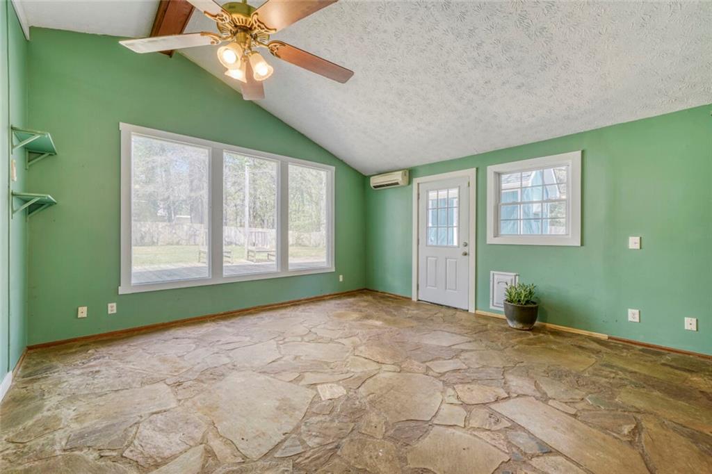 2754 Esquire Way Tucker, GA 30084 - Photo 18 of 49 a view of an empty room with a window and a fan