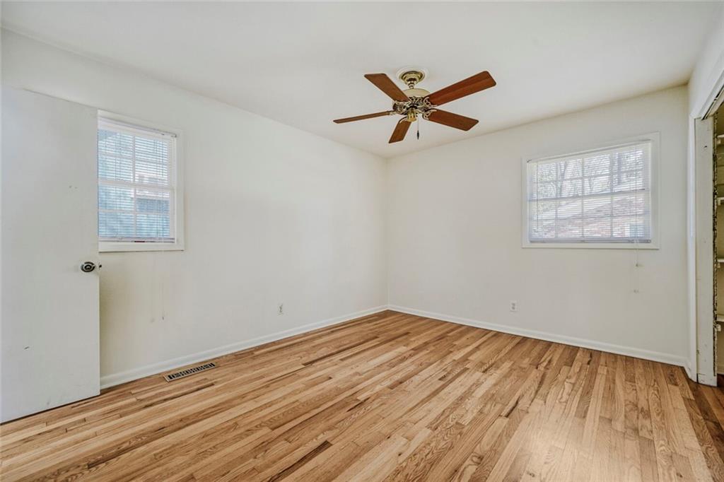2754 Esquire Way Tucker, GA 30084 - Photo 23 of 49 a view of empty room with wooden floor and fan