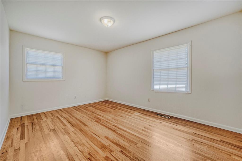 2754 Esquire Way Tucker, GA 30084 - Photo 28 of 49 a view of empty room with wooden floor