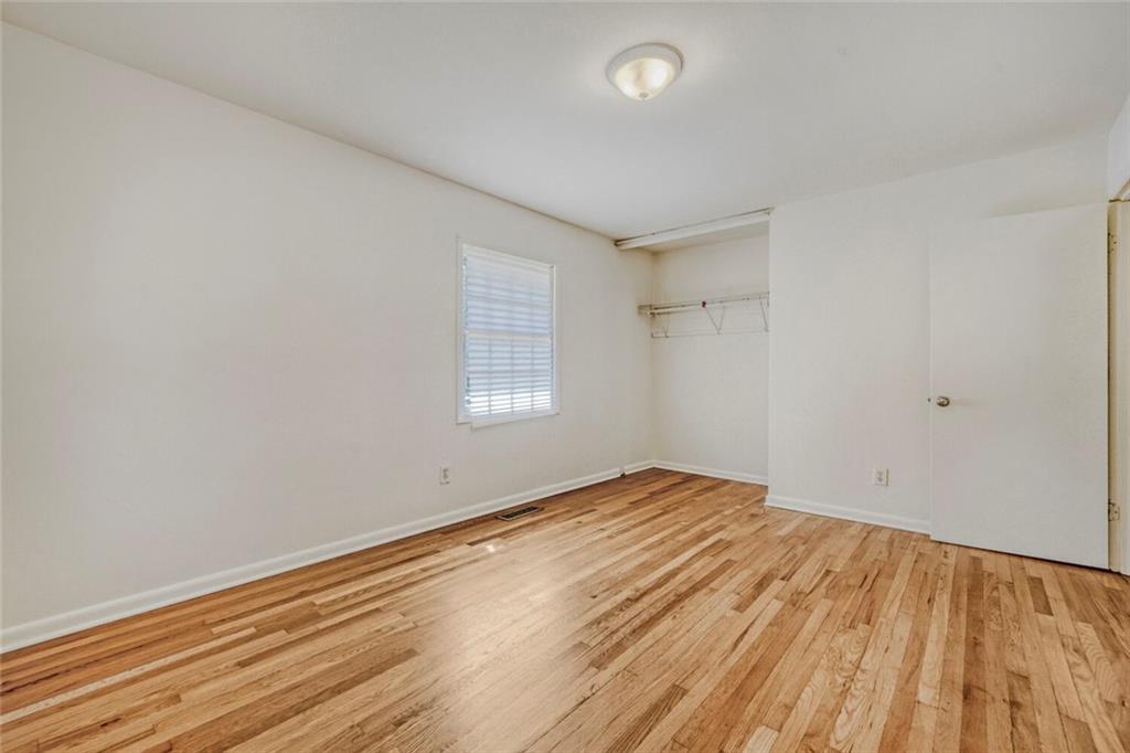 2754 Esquire Way Tucker, GA 30084 - Photo 29 of 49 an empty room with wooden floor and windows
