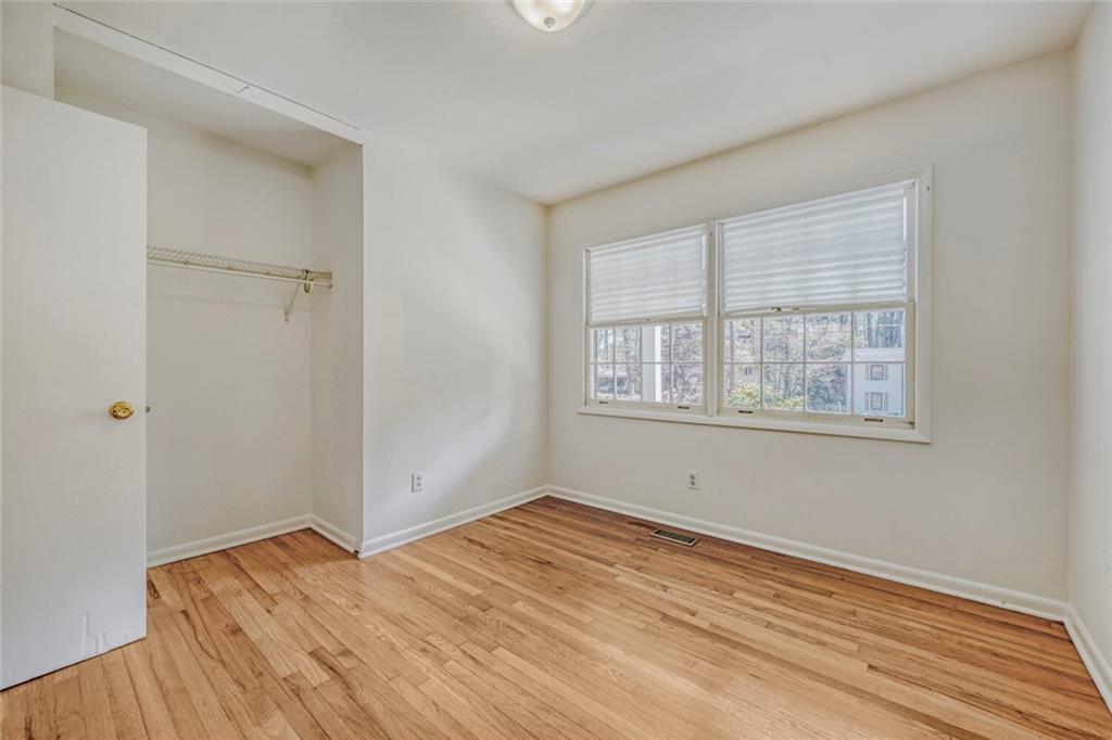 2754 Esquire Way Tucker, GA 30084 - Photo 31 of 49 a view of empty room with wooden floor and fan