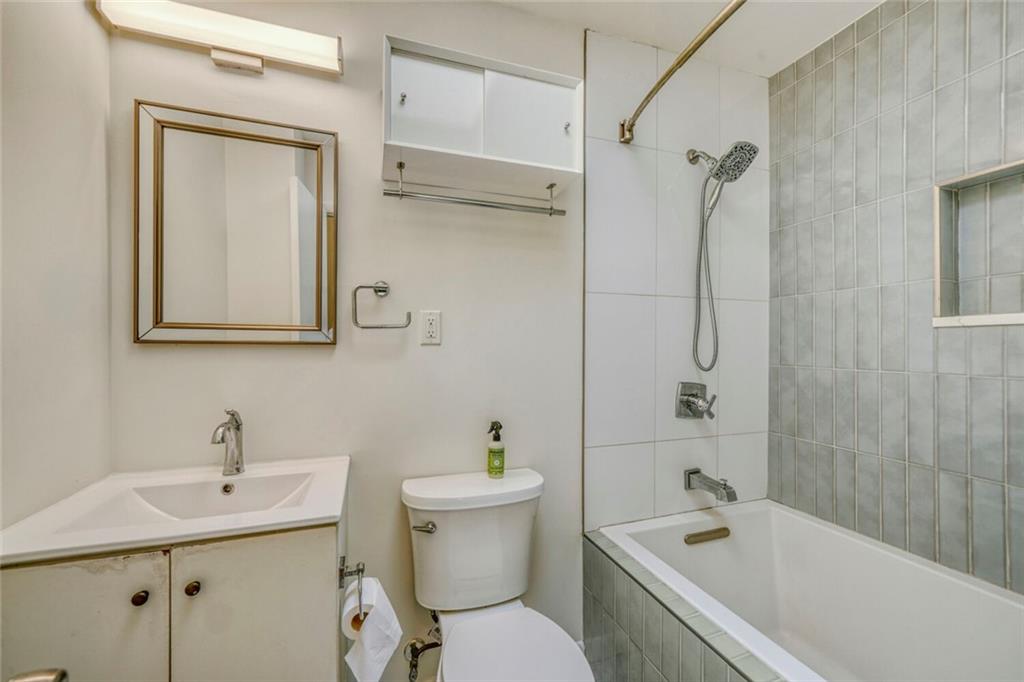 2754 Esquire Way Tucker, GA 30084 - Photo 32 of 49 a bathroom with a sink toilet and shower