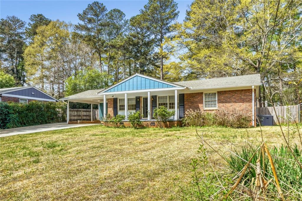 2754 Esquire Way Tucker, GA 30084 - Photo 46 of 49 a front view of a house with a yard