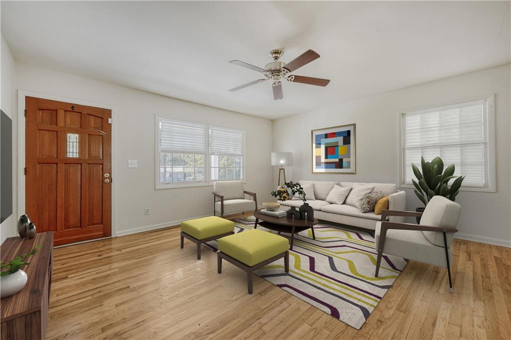 2754 Esquire Way Tucker, GA 30084 - Photo 5 of 49 a living room with furniture and wooden floor