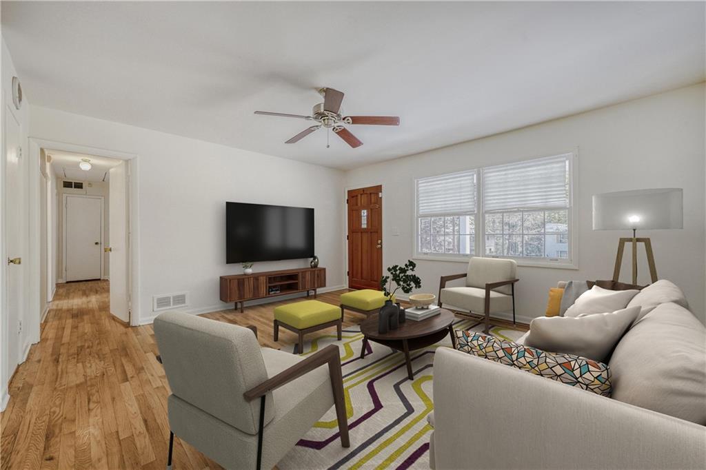 2754 Esquire Way Tucker, GA 30084 - Photo 6 of 49 a living room with furniture and a flat screen tv