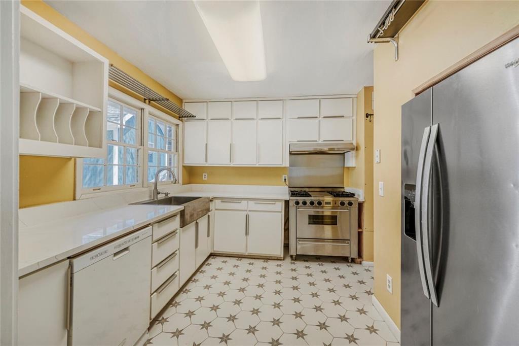 2754 Esquire Way Tucker, GA 30084 - Photo 10 of 49 a kitchen with a refrigerator and a sink