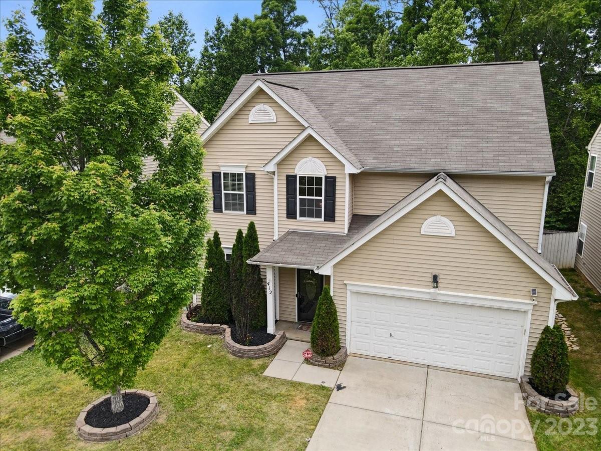 412 Rook Road Charlotte, NC 28216 - Photo 3 of 40 a view of house with backyard space and garden